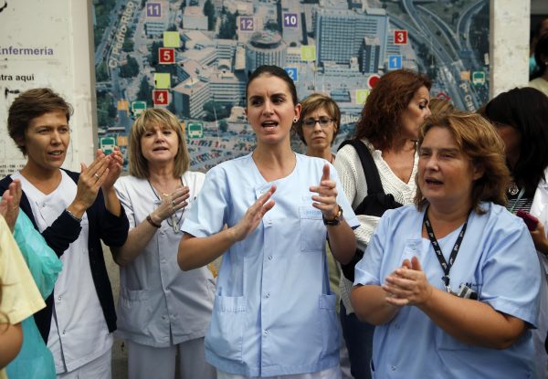 Health workers attend a protest outside La Paz Hospital calling for Spain's Health Minister Ana Mato to resign after a Spanish nurse contracted Ebola, in Madrid