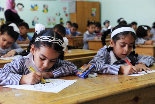 First Day at School in Gaza school   Gaza, 2, September, 2012. Thousands of refugees' children headed for UNRWA schools today September, 2 2012, on their first day of the school year in Gaza Strip despite the harsh economic conditions people in Gaza Strip are suffering from.   People of Gaza Strip suffer harsh economic conditions due to the Israeli blockade enforced over six years ago which affected all life aspects including education. Parents had three occasions that cost high expenses starting with Ramadan, Eid Al Fitr and last but not least the new school year since students require with the beginning of every school year a new uniform, shoes, school bag to say the least in addition to stationary.   However, some refugee families can't afford all this, so some students are forced to wear previous year uniforms which might be worn out.   Nonetheless, faces were radiant with smiles, UNRWA students happy to rejoin their friends and celebrate their first day at school. Teachers welcomed their students in a festive atmosphere to ease the pressure, and in an attempt to integrate them to their schools from the first day to start the concentration process and look to the future with hope.   All parents of UNRWA schools students agree that their children's education is vital and incontrovertible. This comes from their belief that education is the only path to liberate oneself from reality's sufferings in Gaza Strip and that it is the only path to achieve and realize desired goals.   With the beginning of the new school year, teachers and students both hope for the continuity of the school feeding program and stationary that UNRWA has been implementing for three years because of its positive effects on academic achievement. The program alleviates the intensity of the financial crisis that ravages refugee families in Gaza by providing students with money for breakfast and stationary.   The school year has begun and with it voices that demands construction of new schools to relieve overcrowding in schools and classes.