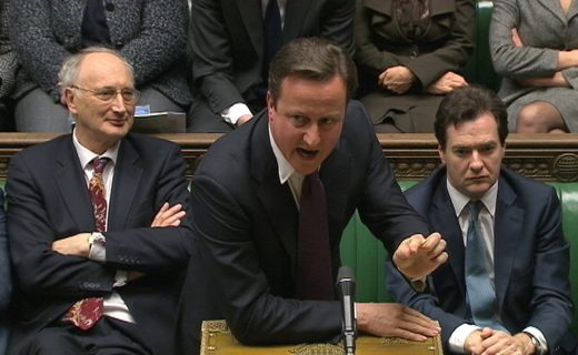 Britain's Prime Minister David Cameron is flanked by Chancellor of the Exchequer George Osborne and Leader of the House of Commons George Young during a parliamentary debate on last week's European Union summit, in London